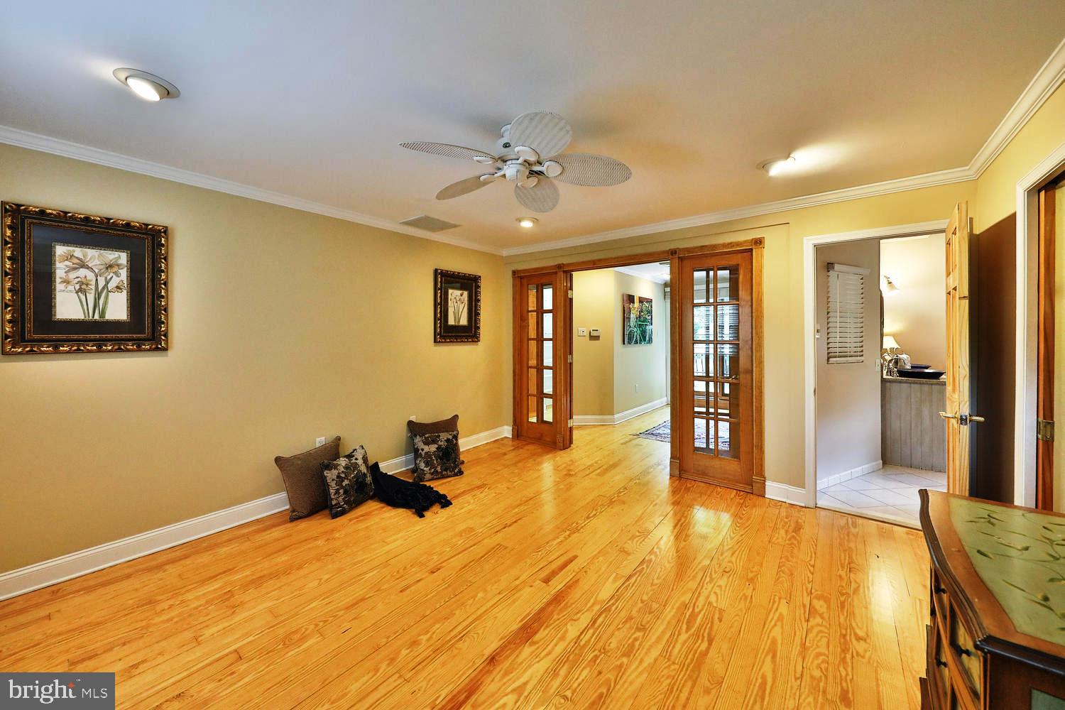 923 Rydal Road Jenkintown, PA 19046 - Photo 29 of 56 a spacious bedroom with a bed and wooden floor