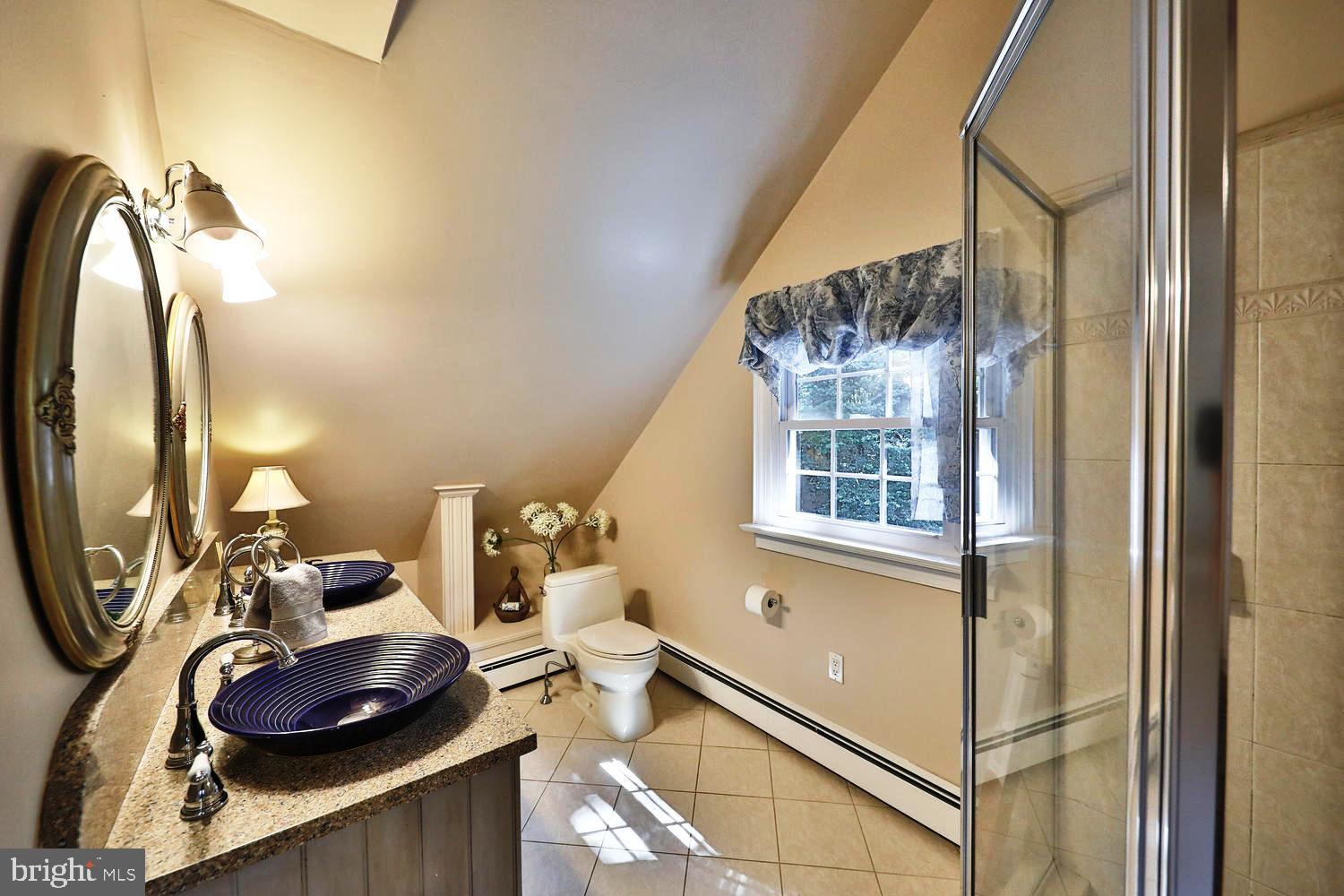 923 Rydal Road Jenkintown, PA 19046 - Photo 31 of 56 a bathroom with a sink and a mirror