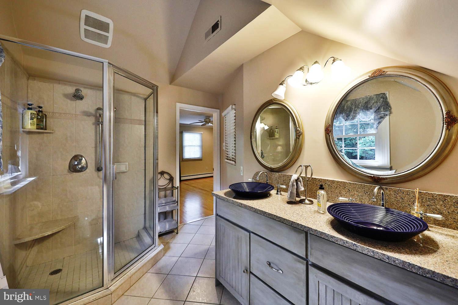 923 Rydal Road Jenkintown, PA 19046 - Photo 32 of 56 a bathroom with a double vanity sink mirror and shower