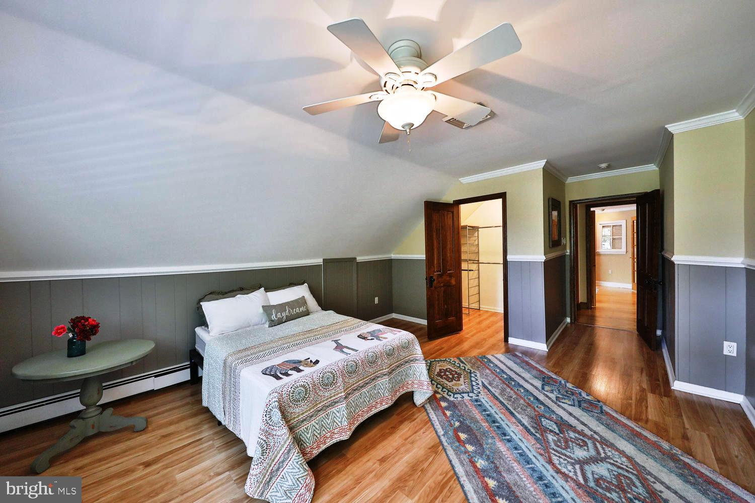 923 Rydal Road Jenkintown, PA 19046 - Photo 34 of 56 a bedroom with a bed and wooden floor