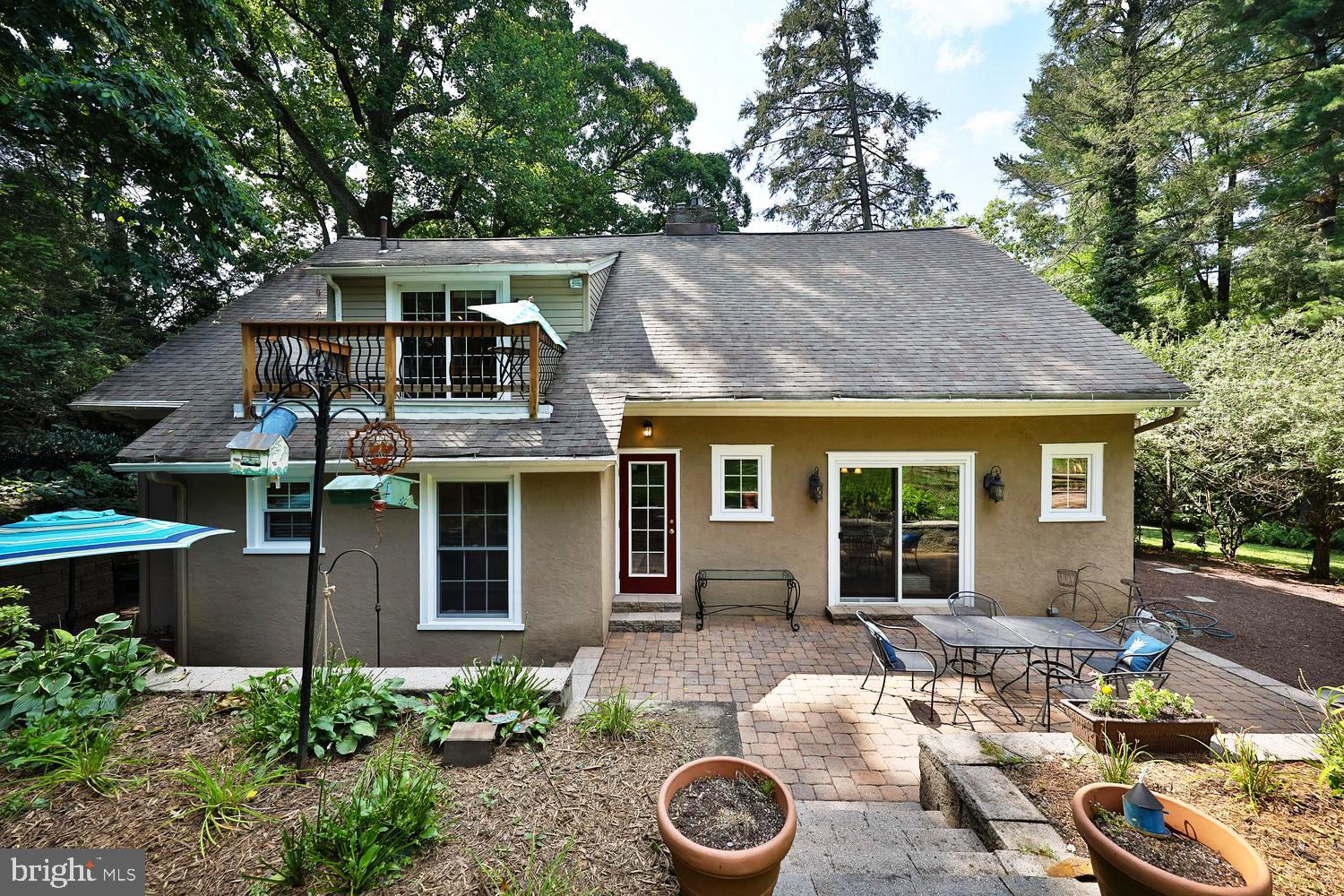 923 Rydal Road Jenkintown, PA 19046 - Photo 42 of 56 a view of a house with backyard sitting area and garden