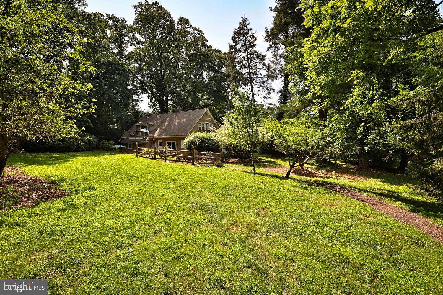 923 Rydal Road Jenkintown, PA 19046 - Photo 49 of 56 a view of a swimming pool with an outdoor space and seating area