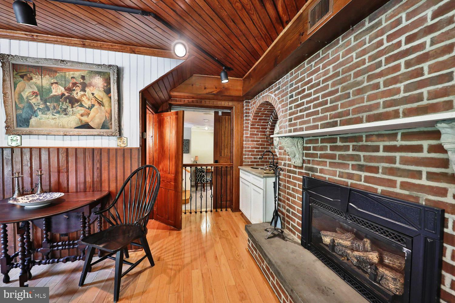 923 Rydal Road Jenkintown, PA 19046 - Photo 8 of 56 a dining room with a wooden table and chairs
