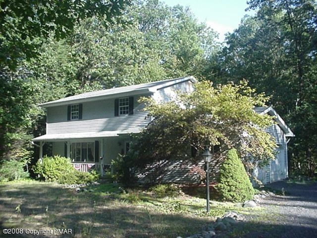 7633 Brislin Road Stroudsburg, PA 18360 - Photo 1 of 1 a front view of a house with a yard
