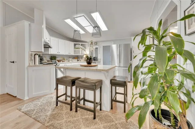 a kitchen with a table and chairs in it