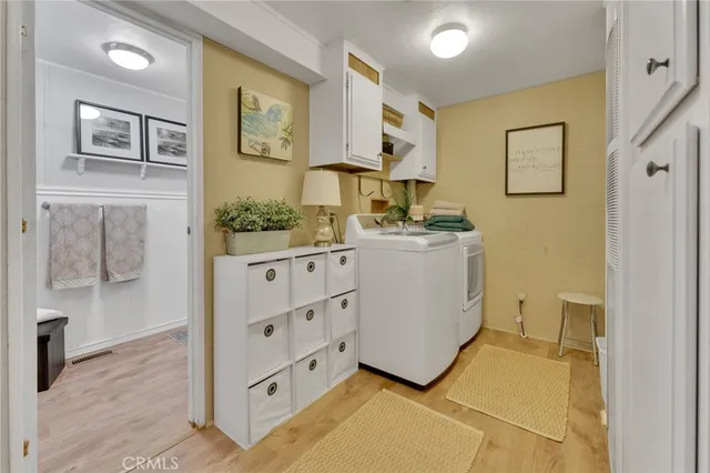 a view of a kitchen with cabinets