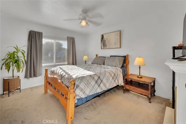 a bedroom with a bed and a lamp