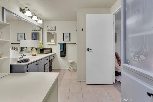 a kitchen with a refrigerator and a stove