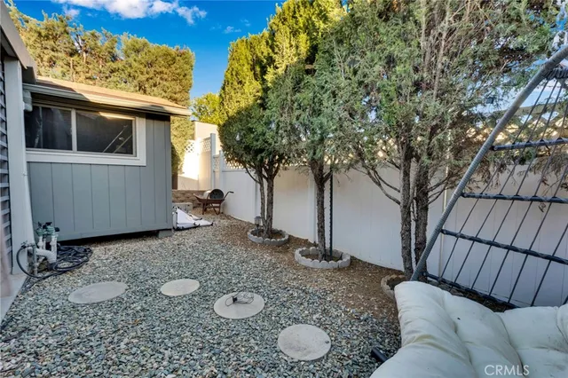 a view of a backyard with furniture