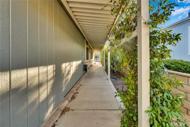 a view of a pathway both side of house
