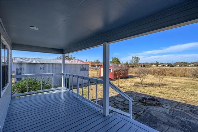 a view of a balcony with an ocean view