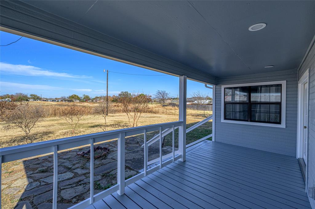 208 West Maple Street Gunter, TX 75058 - Photo 23 of 32 a view of roof deck with large ocean and wooden floor