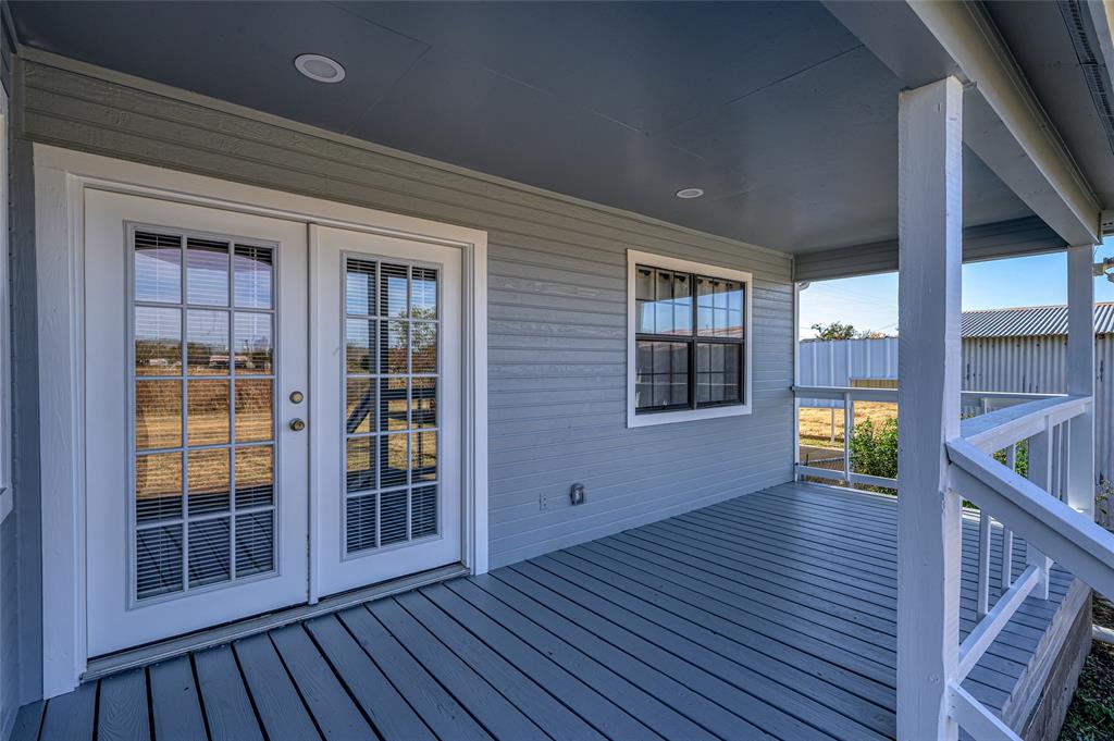 208 West Maple Street Gunter, TX 75058 - Photo 24 of 32 a view of empty room with wooden floor and fan