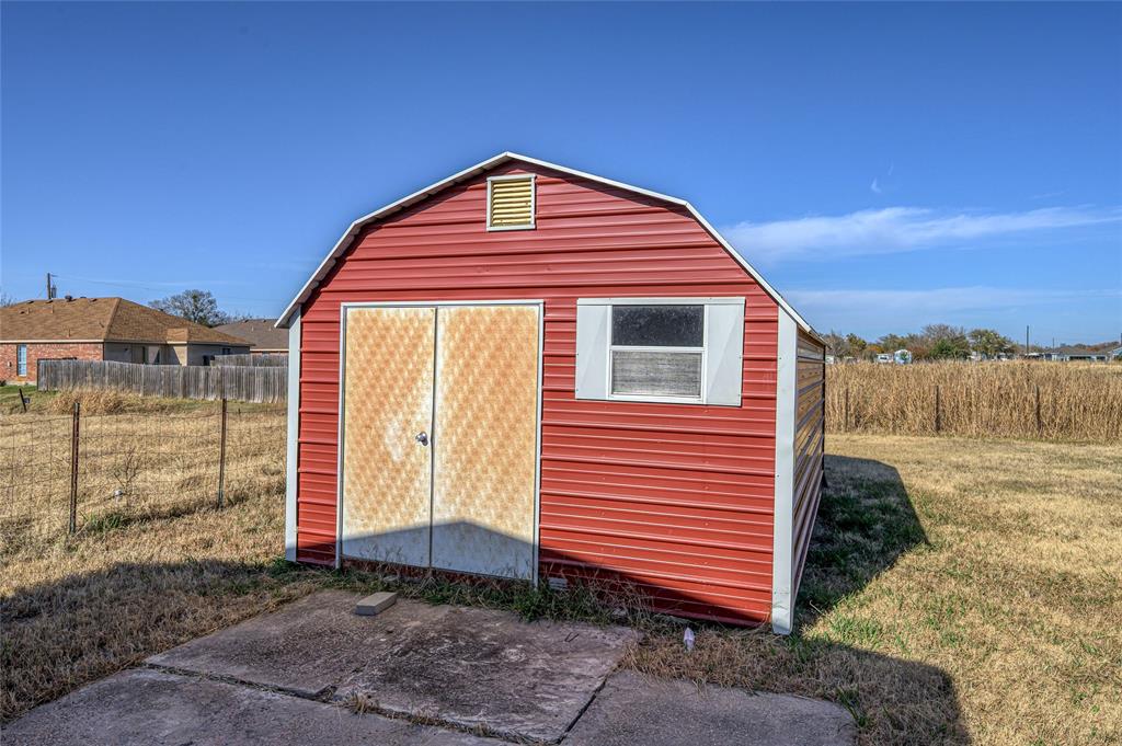 208 West Maple Street Gunter, TX 75058 - Photo 31 of 32 a view of a house with a yard
