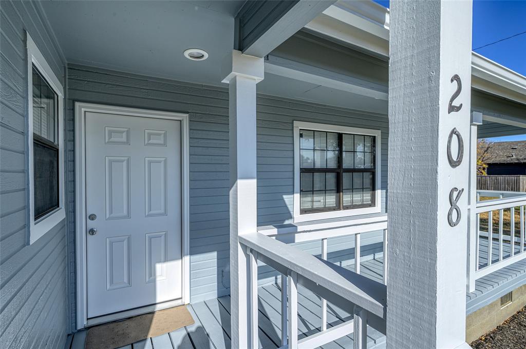 208 West Maple Street Gunter, TX 75058 - Photo 5 of 32 a view of front door of house