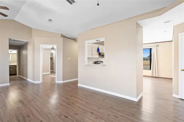 a view of a livingroom with wooden floor
