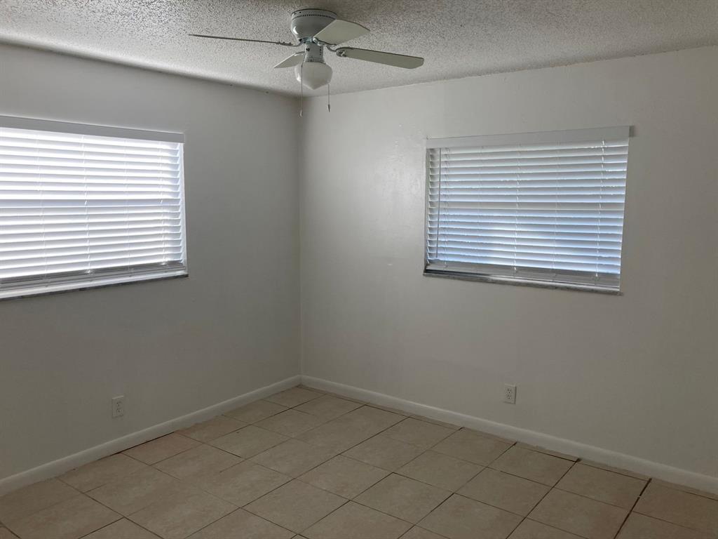 3600 Riverside Drive, Unit B Coral Springs, FL 33065 - Photo 2 of 9 an empty room with a window