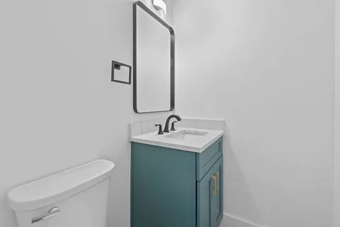 a stove top oven sitting inside of a kitchen