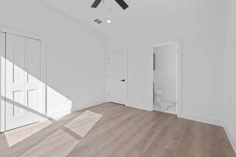 an empty room with windows and entrance