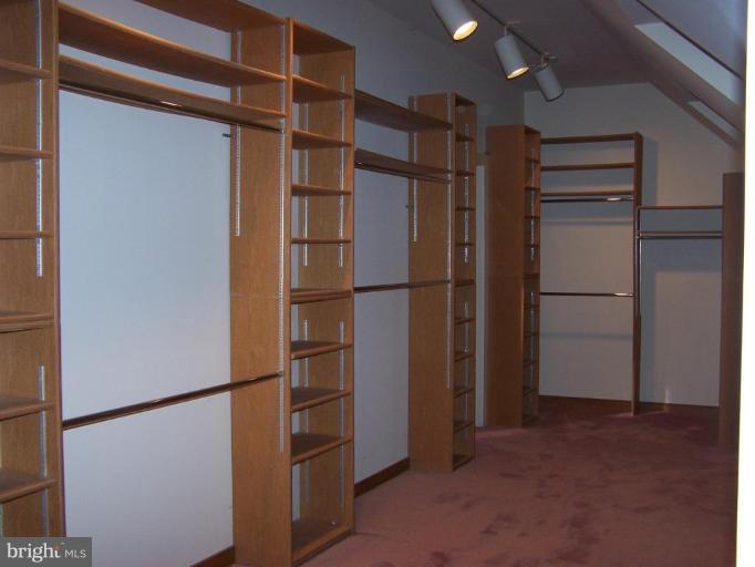 10 Redgate Court Silver Spring, MD 20905 - Photo 12 of 30 a view of walk in closet with empty racks