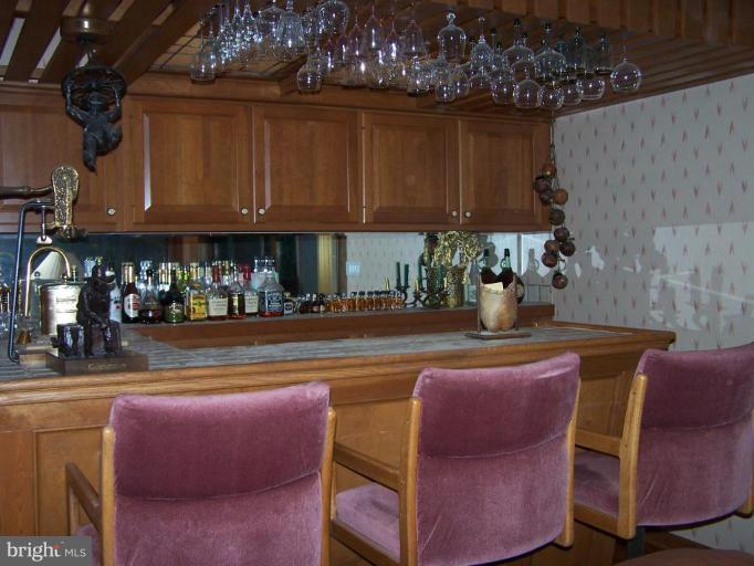 10 Redgate Court Silver Spring, MD 20905 - Photo 22 of 30 a view of a dining room with furniture and a kitchen area