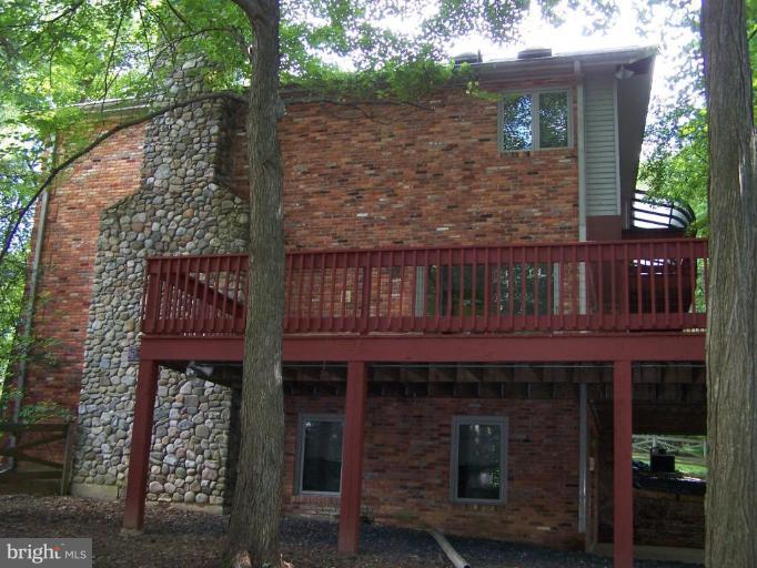 10 Redgate Court Silver Spring, MD 20905 - Photo 30 of 30 a view of a wooden house with a large tree