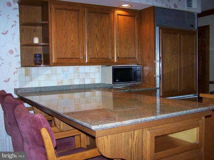 10 Redgate Court Silver Spring, MD 20905 - Photo 5 of 30 a kitchen with an oven a cabinets and a counter top space