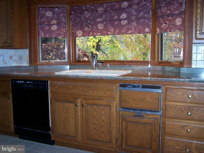 10 Redgate Court Silver Spring, MD 20905 - Photo 7 of 30 a kitchen with a sink and a large window