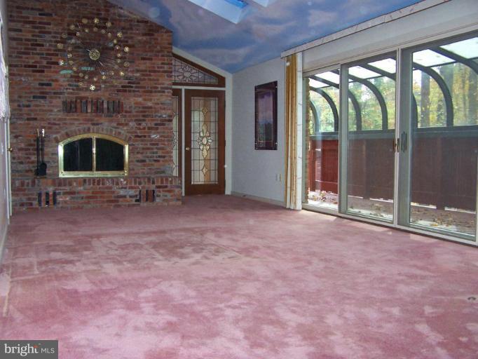 10 Redgate Court Silver Spring, MD 20905 - Photo 9 of 30 an empty room with a fireplace