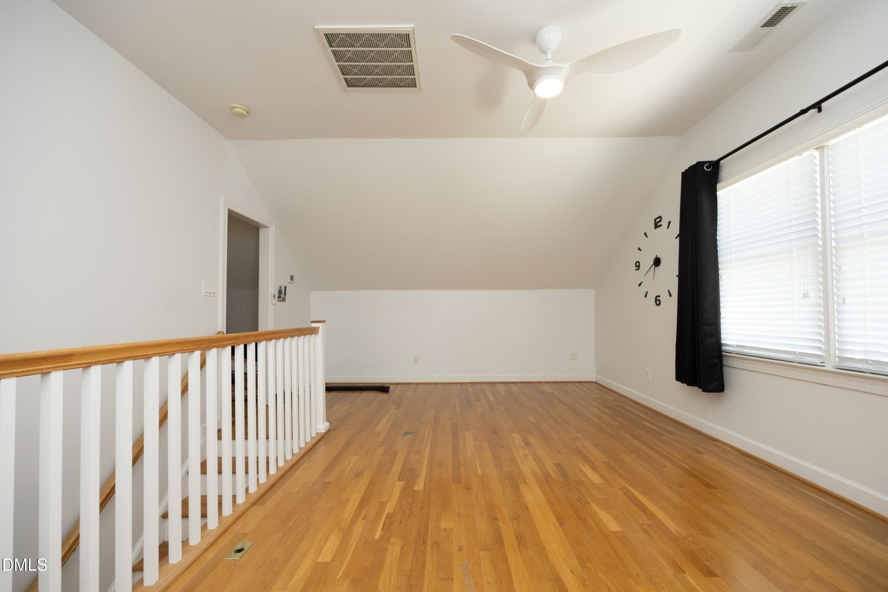 1427 Moosecreek Drive Raleigh, NC 27614 - Photo 29 of 51 a view of a hallway with wooden floor