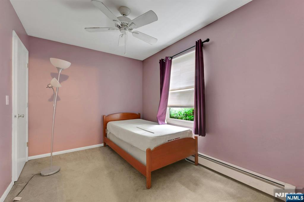 17 Butler Place Wanaque, NJ 07420 - Photo 12 of 28 a bedroom with a bed and window