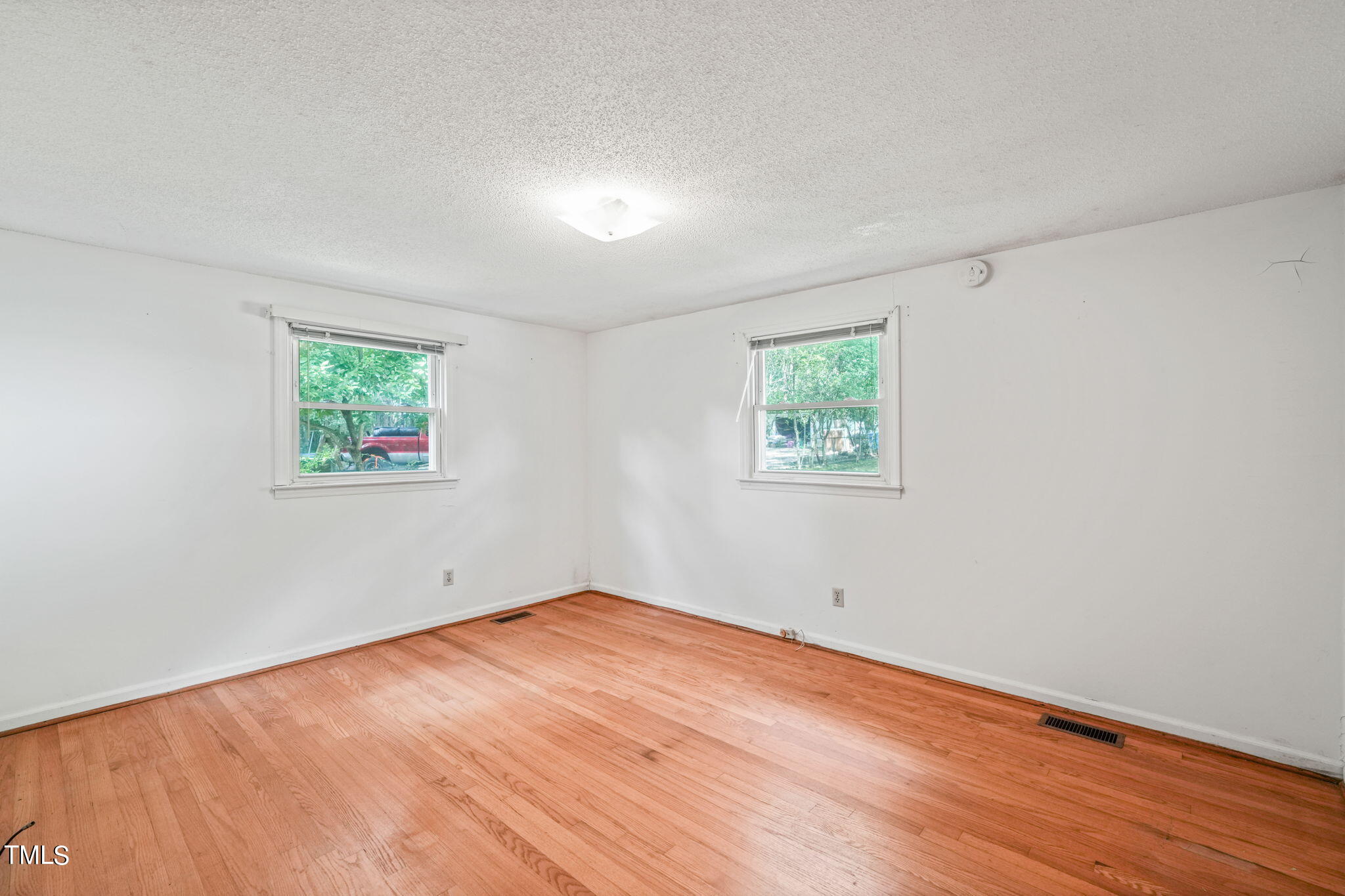 3015 Old Raleigh Road Apex, NC 27502 - Photo 24 of 47 an empty room with wooden floor and window