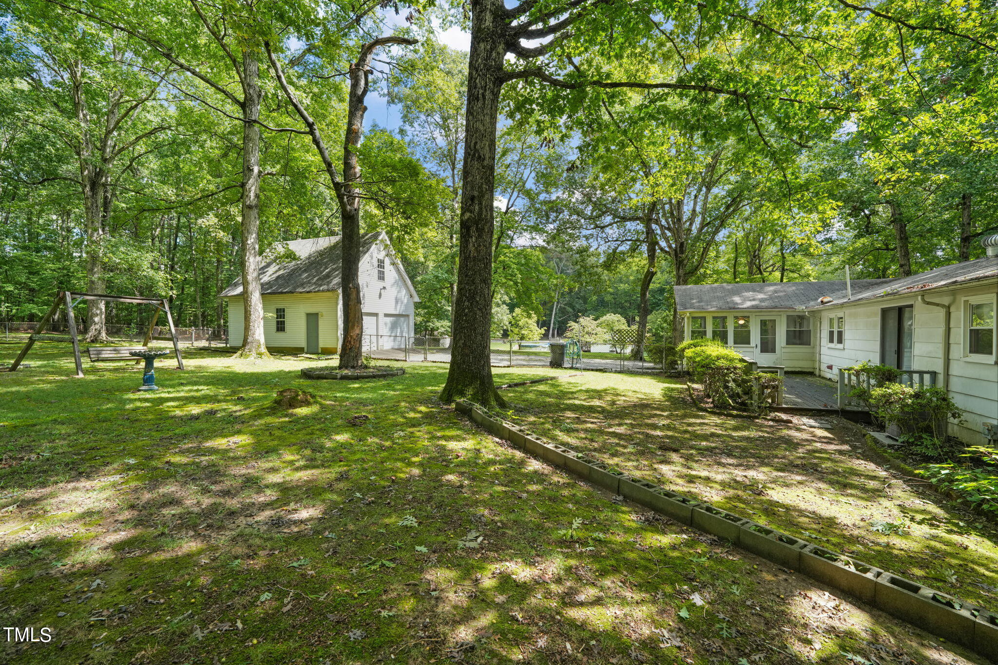 3015 Old Raleigh Road Apex, NC 27502 - Photo 29 of 47 a view of a house with a big yard and large trees
