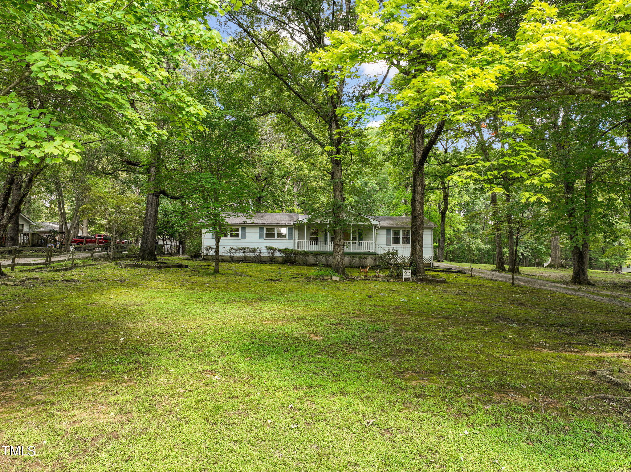 3015 Old Raleigh Road Apex, NC 27502 - Photo 3 of 47 a front view of a house with a big yard