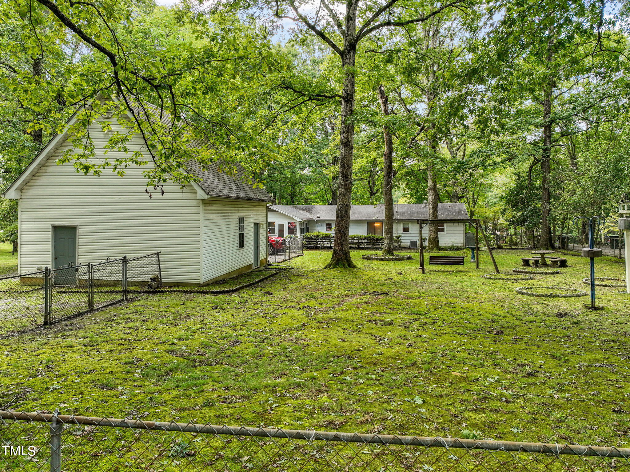 3015 Old Raleigh Road Apex, NC 27502 - Photo 33 of 47 a view of a house with backyard and a tree