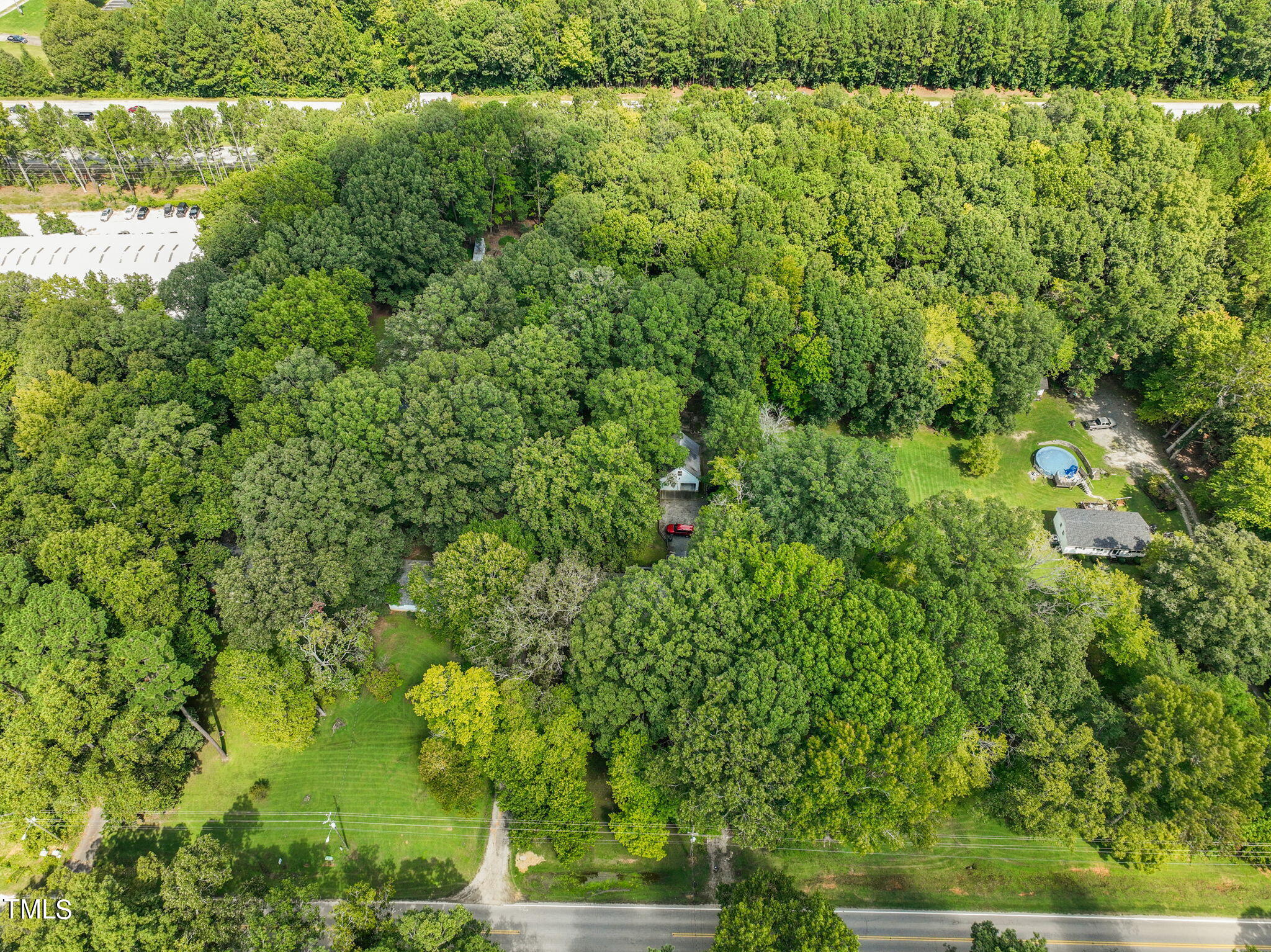 3015 Old Raleigh Road Apex, NC 27502 - Photo 4 of 47 a view of a lush green forest with a lake