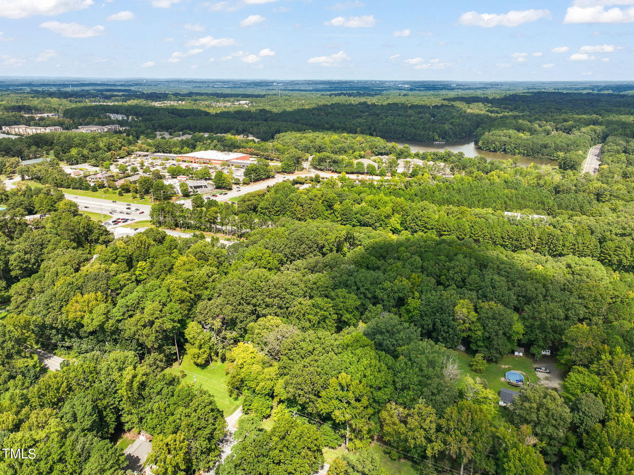 3015 Old Raleigh Road Apex, NC 27502 - Photo 47 of 47 a view of a lake with a building in the background