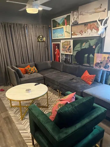 a living room with furniture and a table