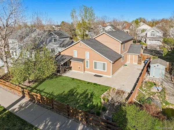 a aerial view of a house with a yard