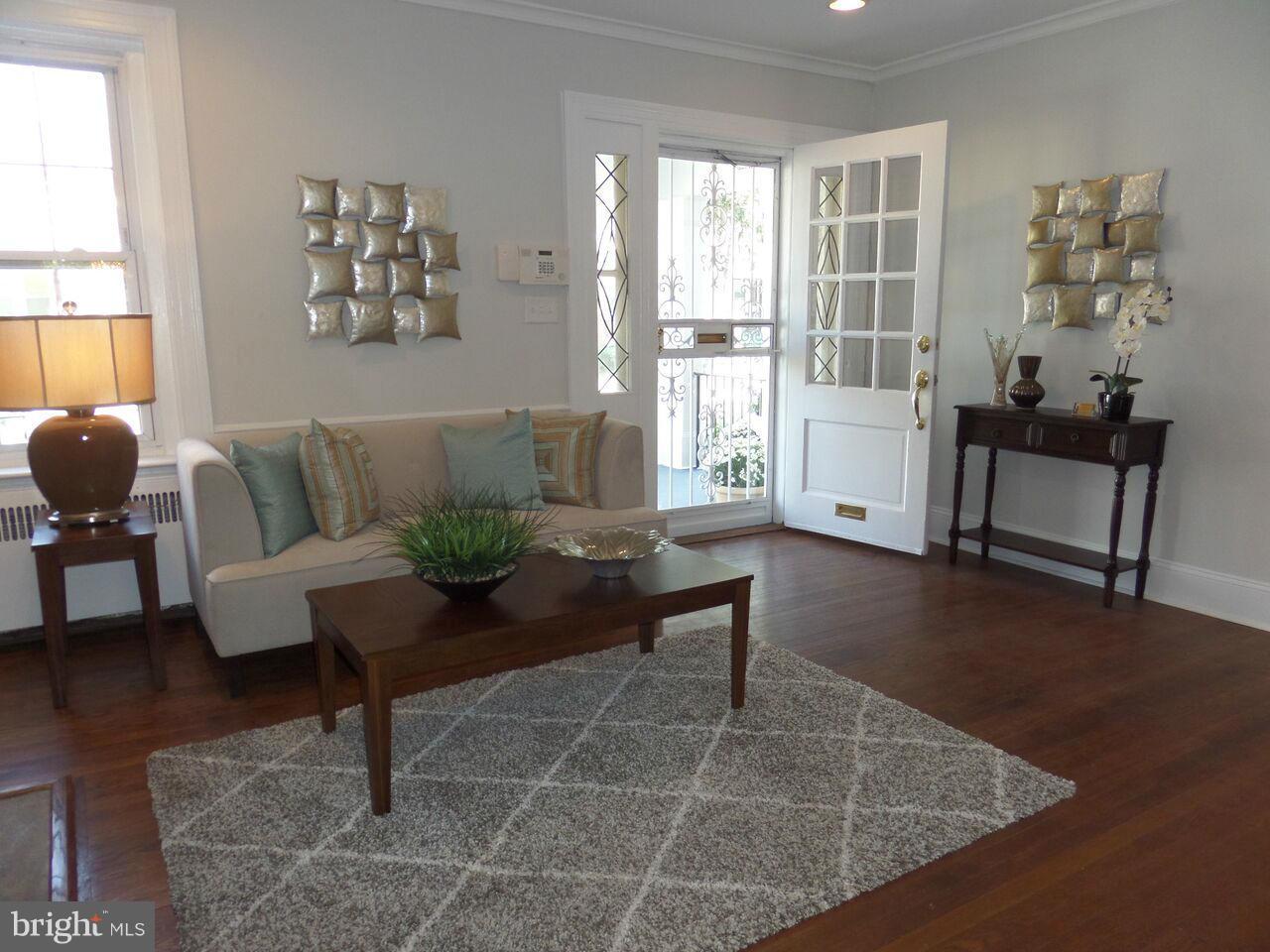 1326 Rittenhouse Street Northwest Washington, DC 20011 - Photo 3 of 28 a living room with furniture and windows