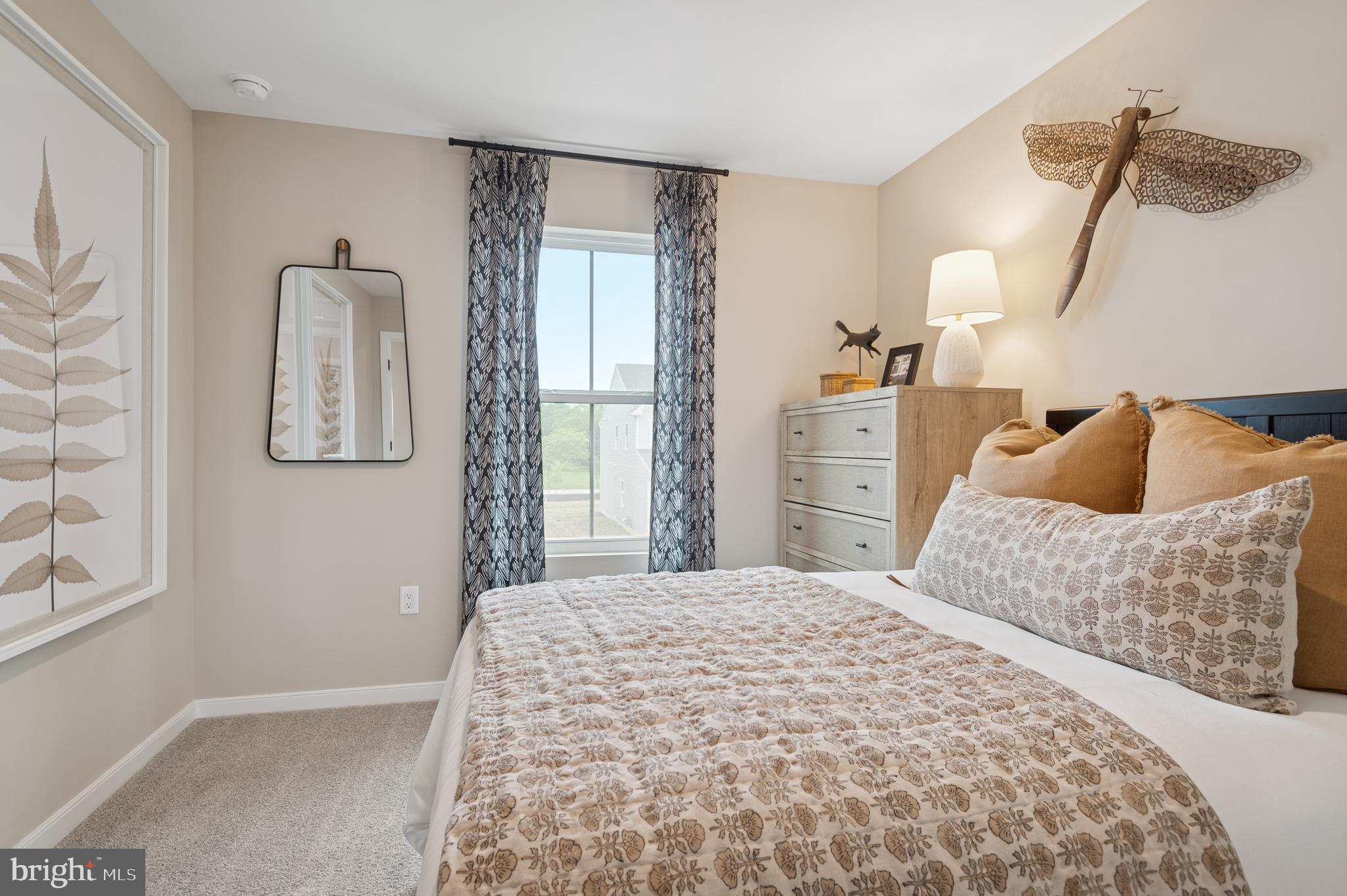23 Butternut Drive, Unit 12 Berlin, NJ 08009 - Photo 20 of 38 a bedroom with a bed and a window