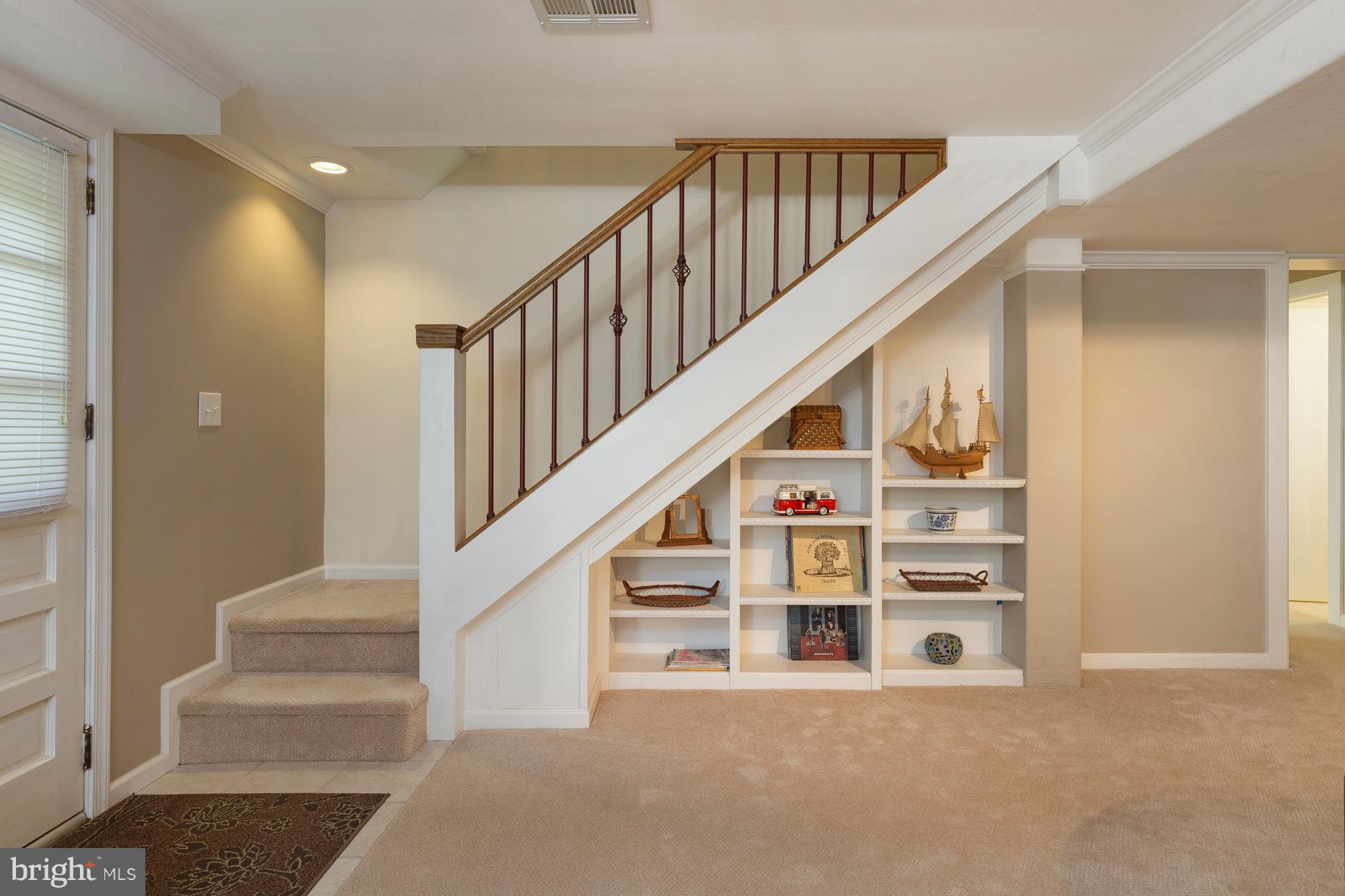 1911 Artillery Ridge Road Fredericksburg, VA 22408 - Photo 16 of 27 Recessed Bookcase under stairs to family room