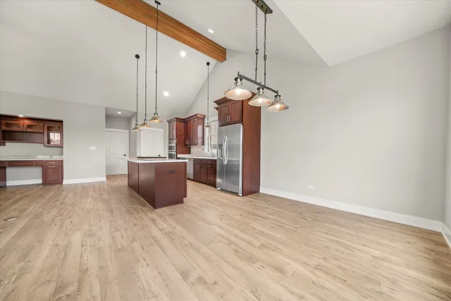 a spacious bathroom with a granite countertop sink a mirror and a bathtub