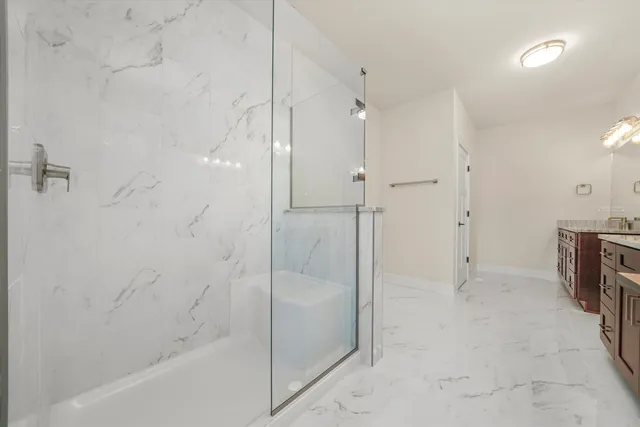 a spacious bathroom with a granite countertop double vanity sink mirror and
