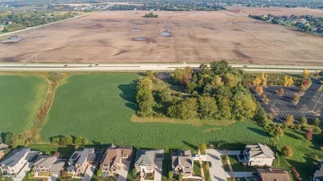 an aerial view of a houses with outdoor space