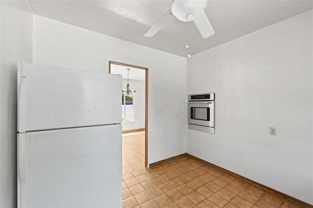 524 McElheny Road Glenshaw, PA 15116 - Photo 25 of 41 a view of a hallway with a refrigerator