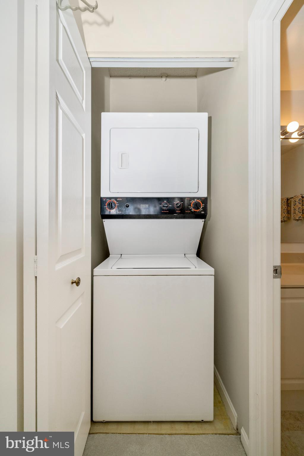 3005 South Leisure World Boulevard, Unit 306 Silver Spring, MD 20906 - Photo 17 of 71 a utility room with dryer and washer