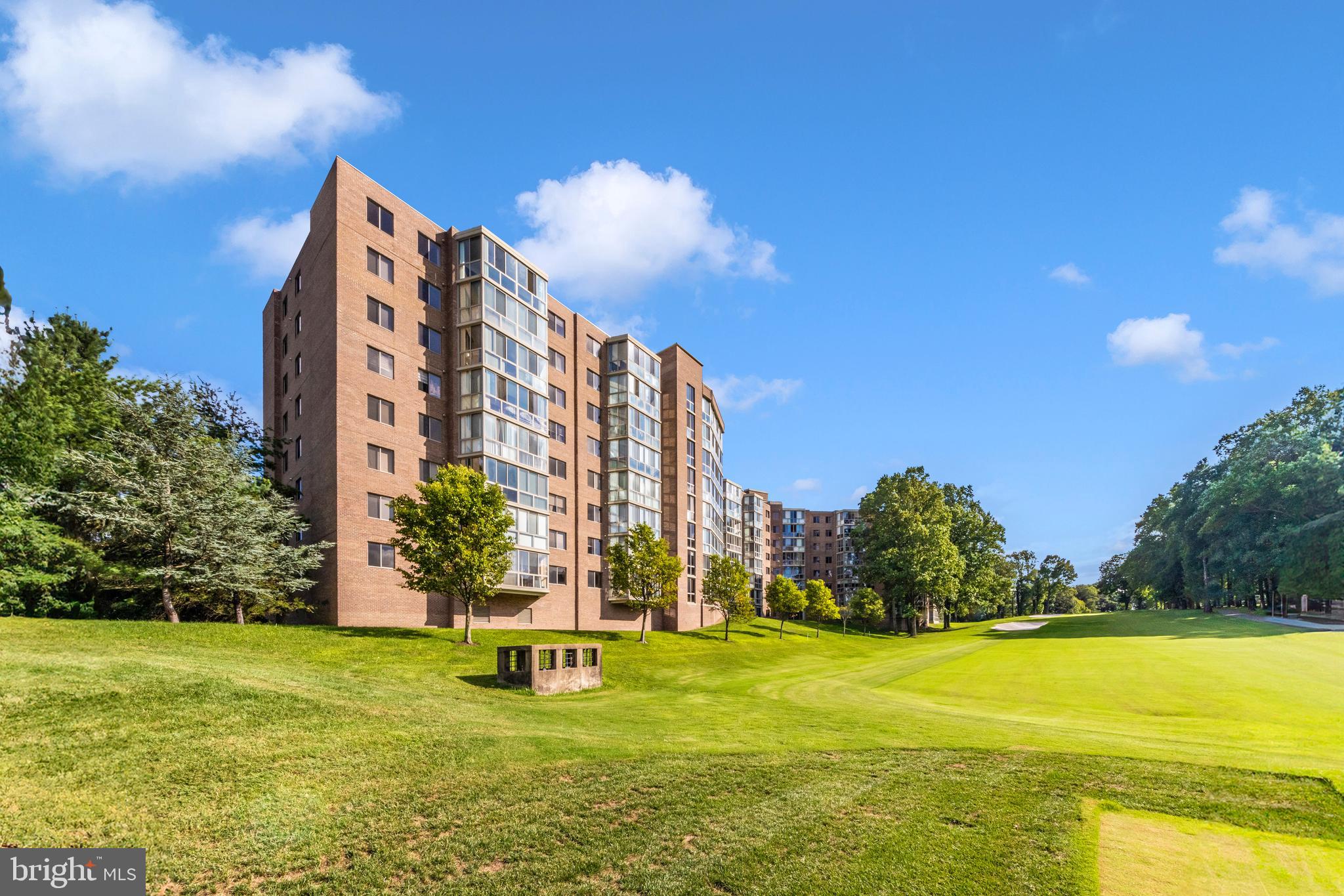 3005 South Leisure World Boulevard, Unit 306 Silver Spring, MD 20906 - Photo 29 of 71 a swimming pool with outdoor seating and yard