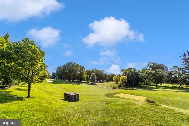 a view of a hallway with wooden shelves
