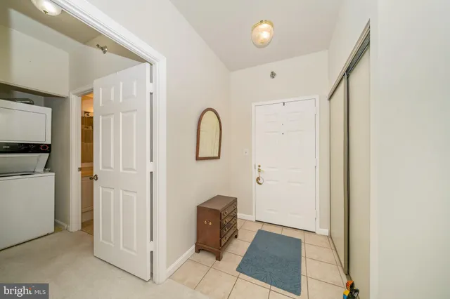 a kitchen with a sink a counter space and cabinets